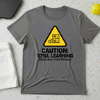 Caution still learning, stay clear of the kitchen T-Shirt