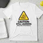 Caution still learning, stay clear of the kitchen T-Shirt