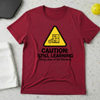 Caution still learning, stay clear of the kitchen T-Shirt
